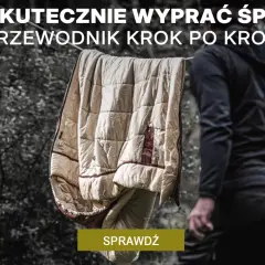Jak prać śpiwór? Przewodnik krok po kroku. Śpiwór schnie na sznurku, a obok stoi osoba w czarnej bluzie.